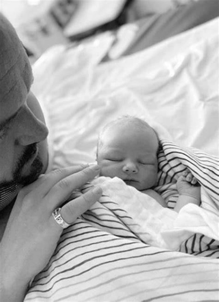 Mum and baby: Melissa Suffield looked incredible on Tuesday as she stripped naked to share a throwback black and white snap of herself feeding son River, 16, months to mark World Breastfeeding Week